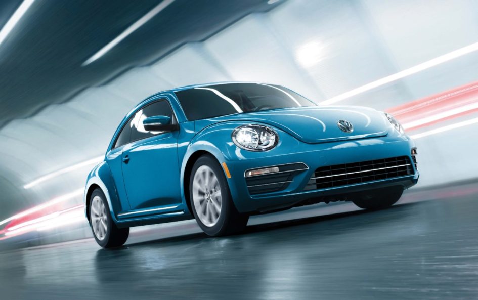 Blue 2017 VW Beetle driving through a tunnel