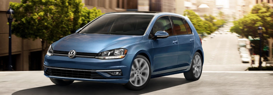 Blue 2019 Volkswagen Golf driving on city streets
